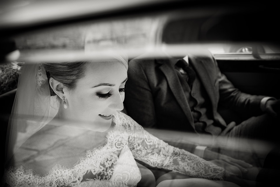 bride in wedding car