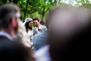 coupel talking during their wedding ceremony